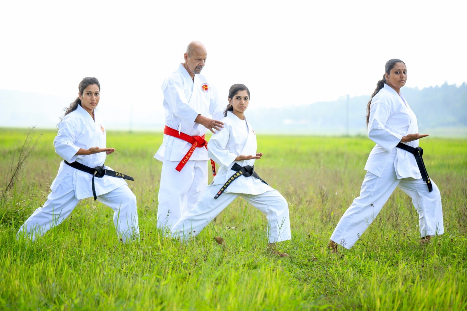 Home hanshi ravindran k.p providing one on one technique corrections to a student during a karate lesson.n (large)